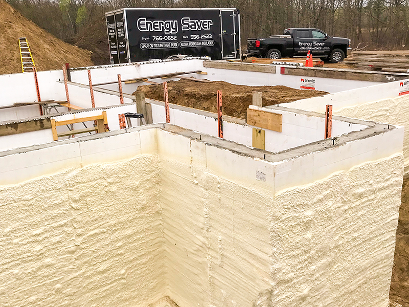 spray foam on the layout of a new construction build